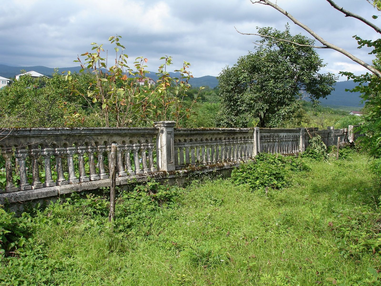 An old balustrade against the hills.