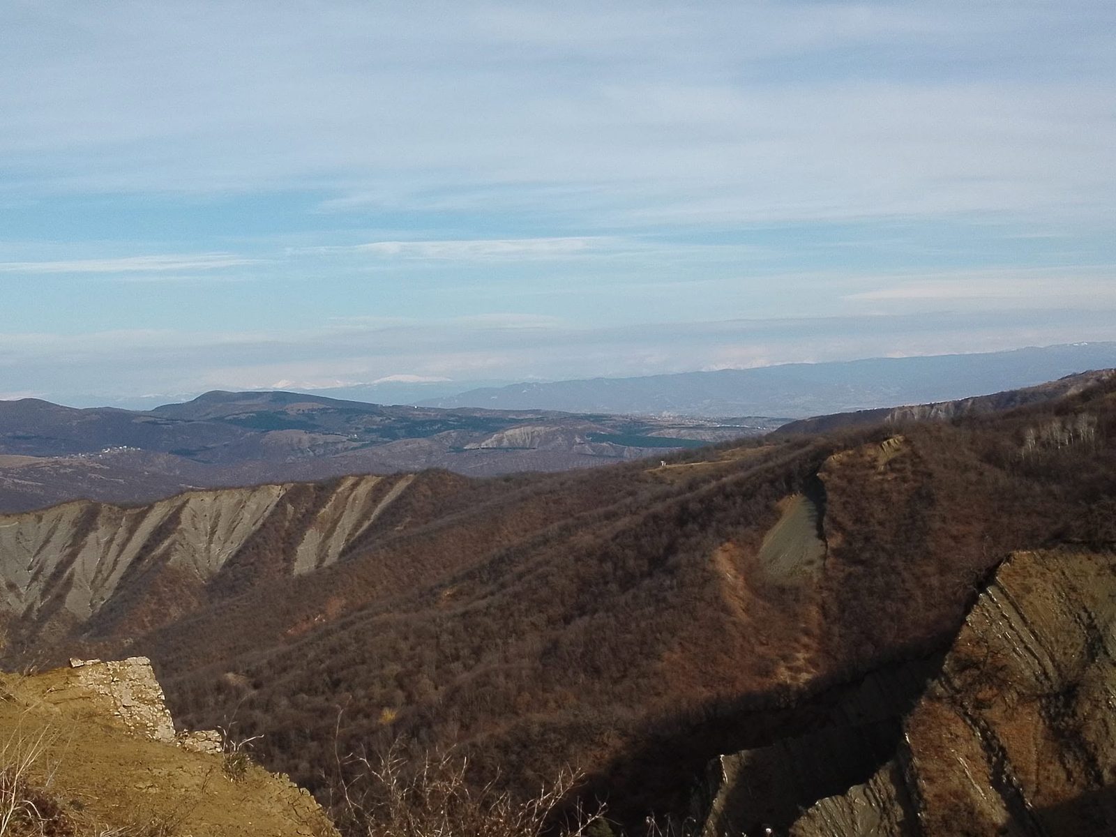 Russet slopes and gullies washed out by rain.
