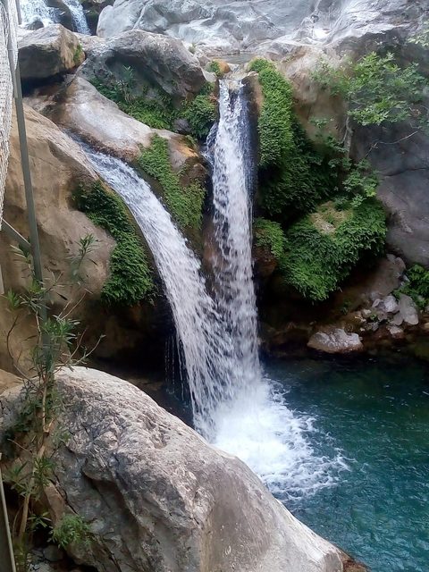 A day in the mountains: a waterfall and misty slopes